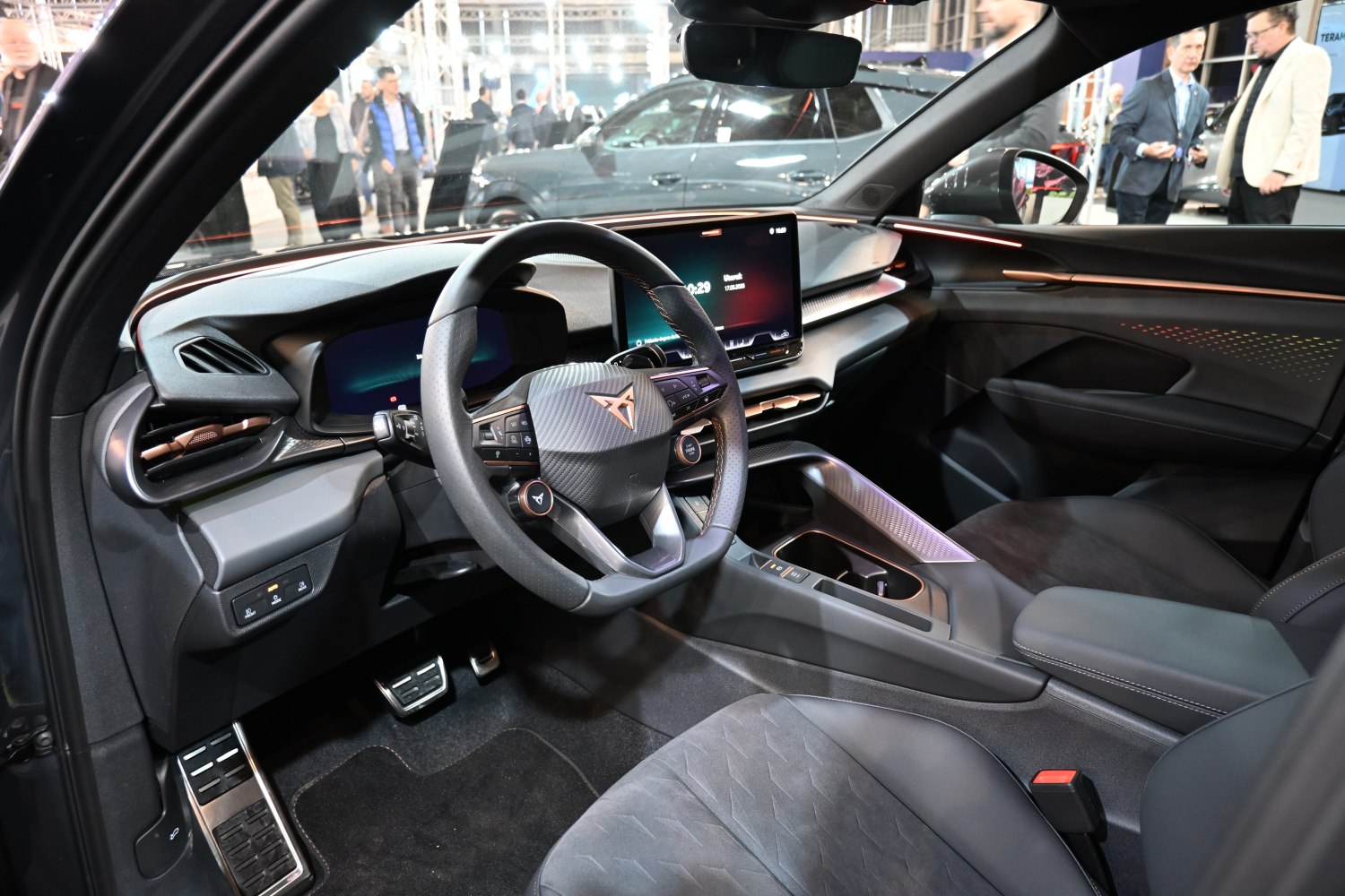 Modern digital dashboard with touchscreen and sporty steering wheel