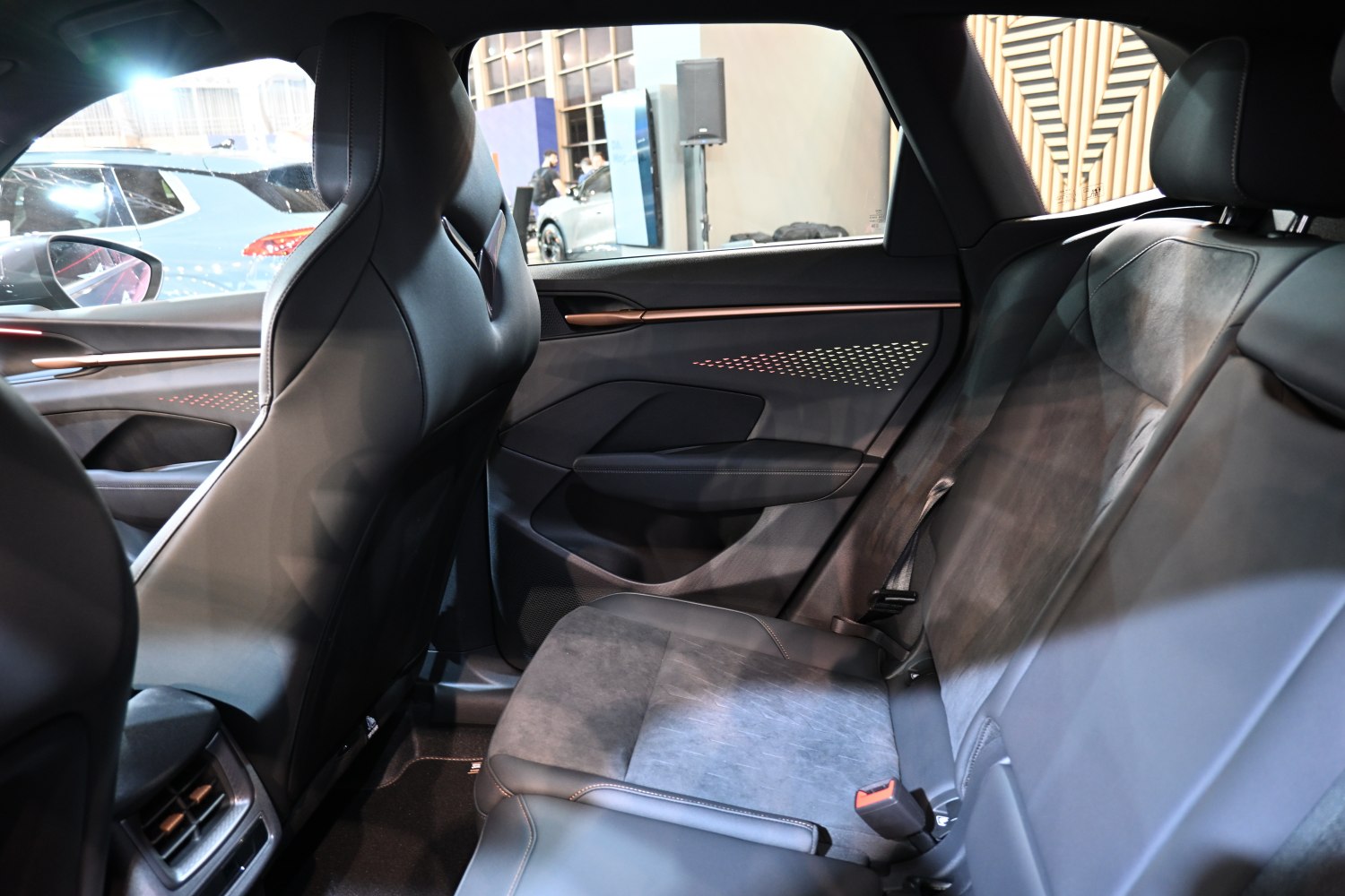Rear interior seating and door panel with premium materials.