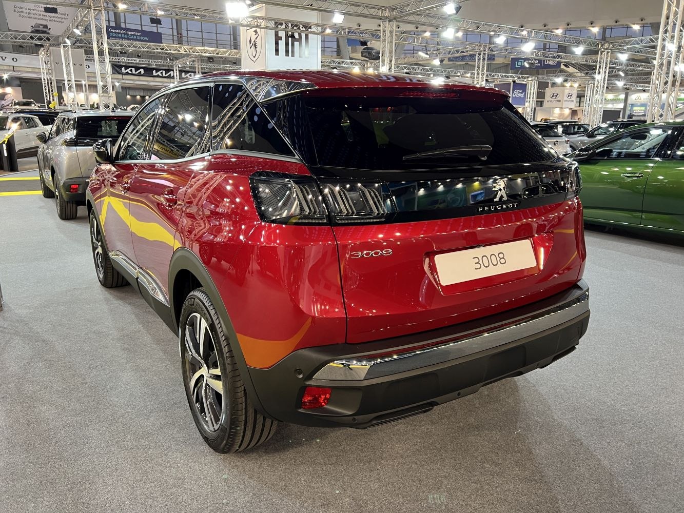 Red SUV rear with distinctive tail lights and sleek design