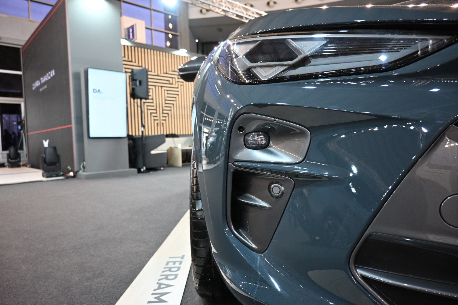 Close-up of SUV headlight and front sensor area