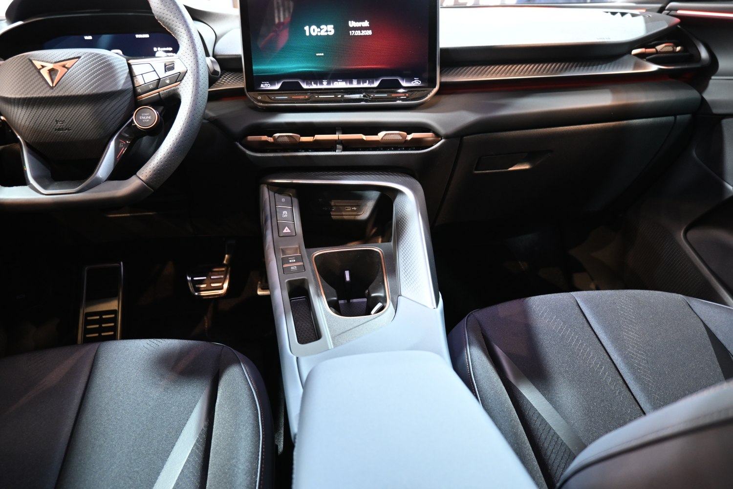 Sporty steering wheel and large central touchscreen display