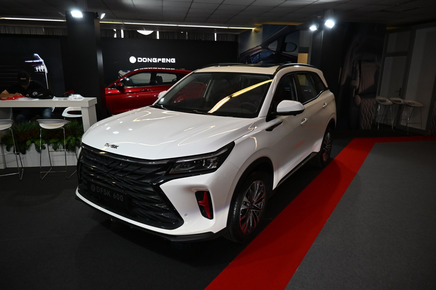 White SUV with black angular front grille and distinctive headlight design