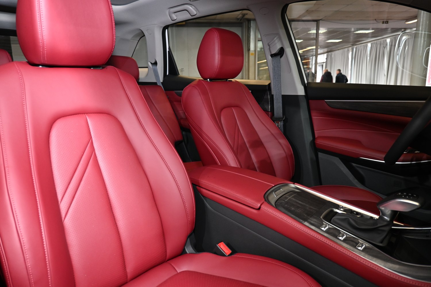 Premium red leather ergonomic front seats with advanced center console.