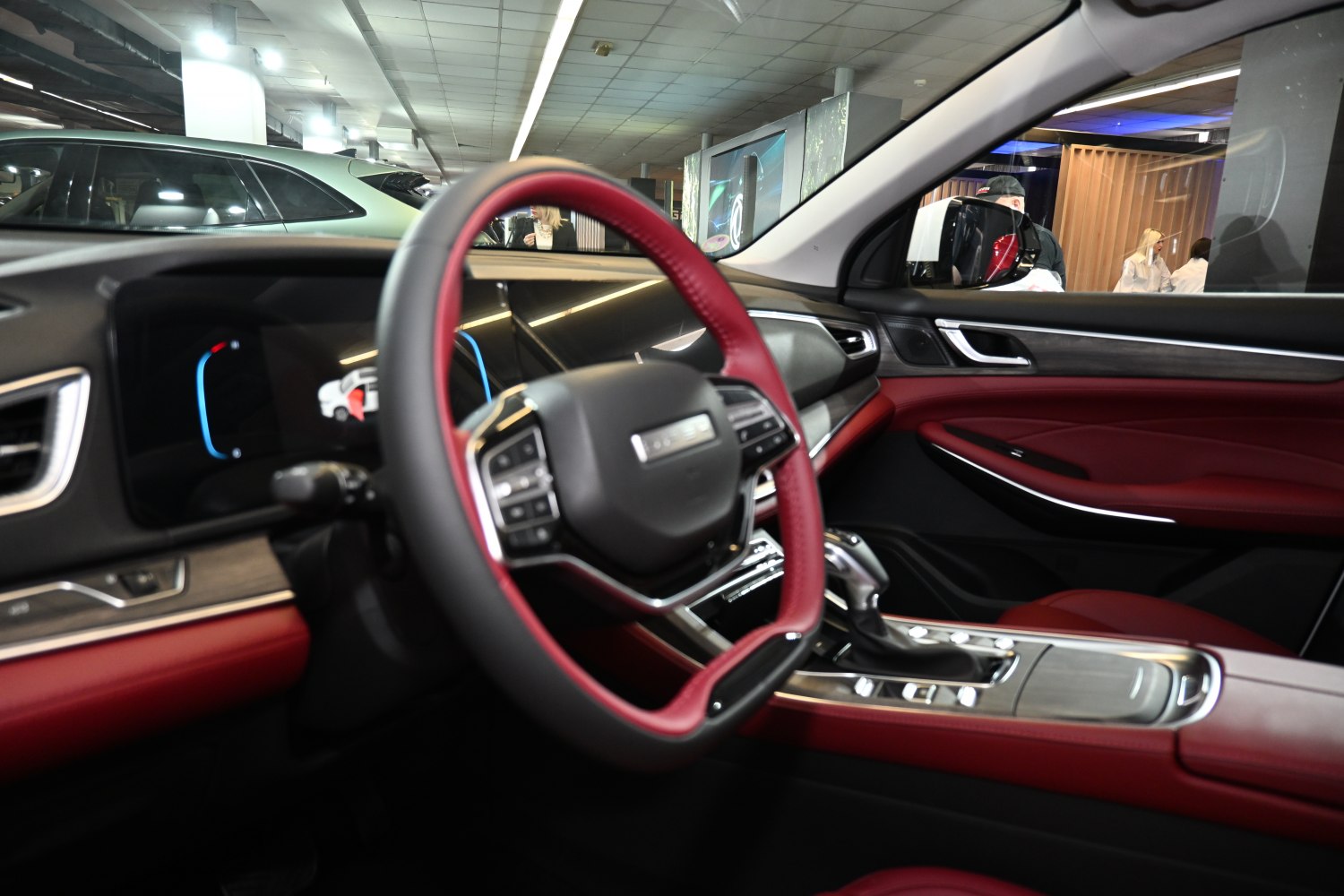 Steering wheel and digital dashboard with red leather interior