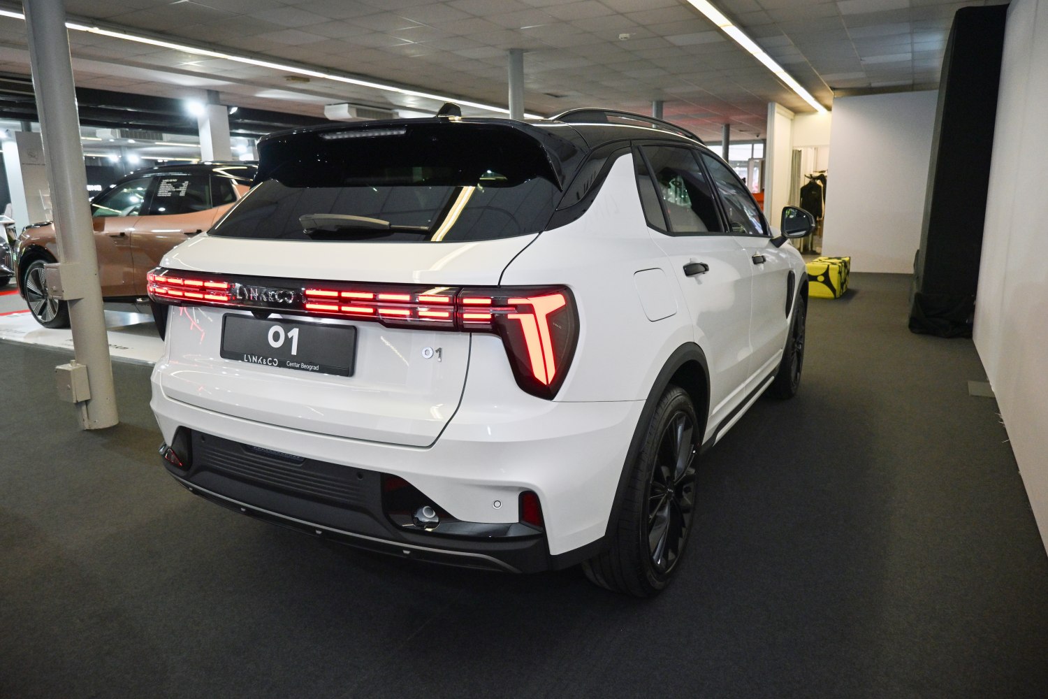 Modern LED rear lights and black roof on a white SUV rear