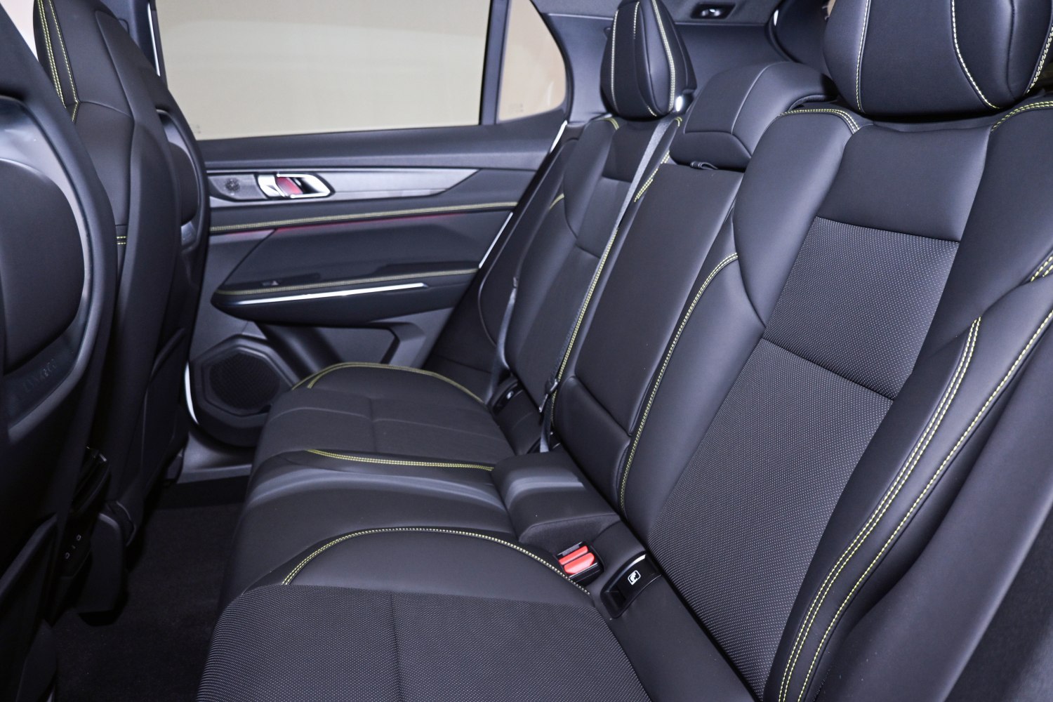Rear passenger seating with black leather and contrast stitching