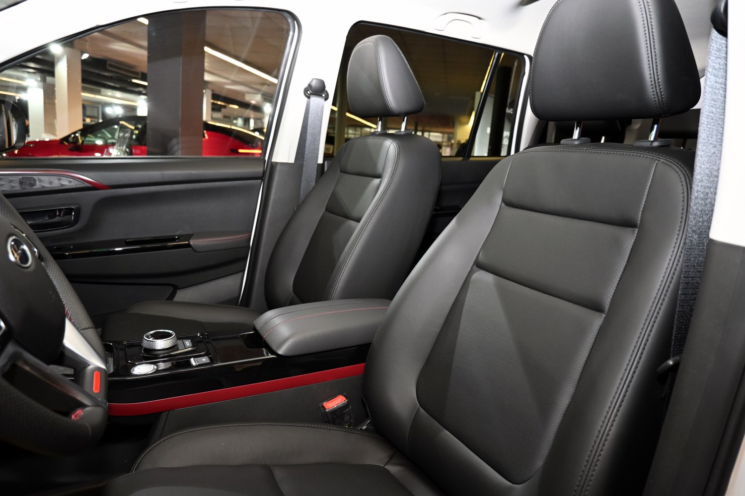 Black leather front seats with center console control dial