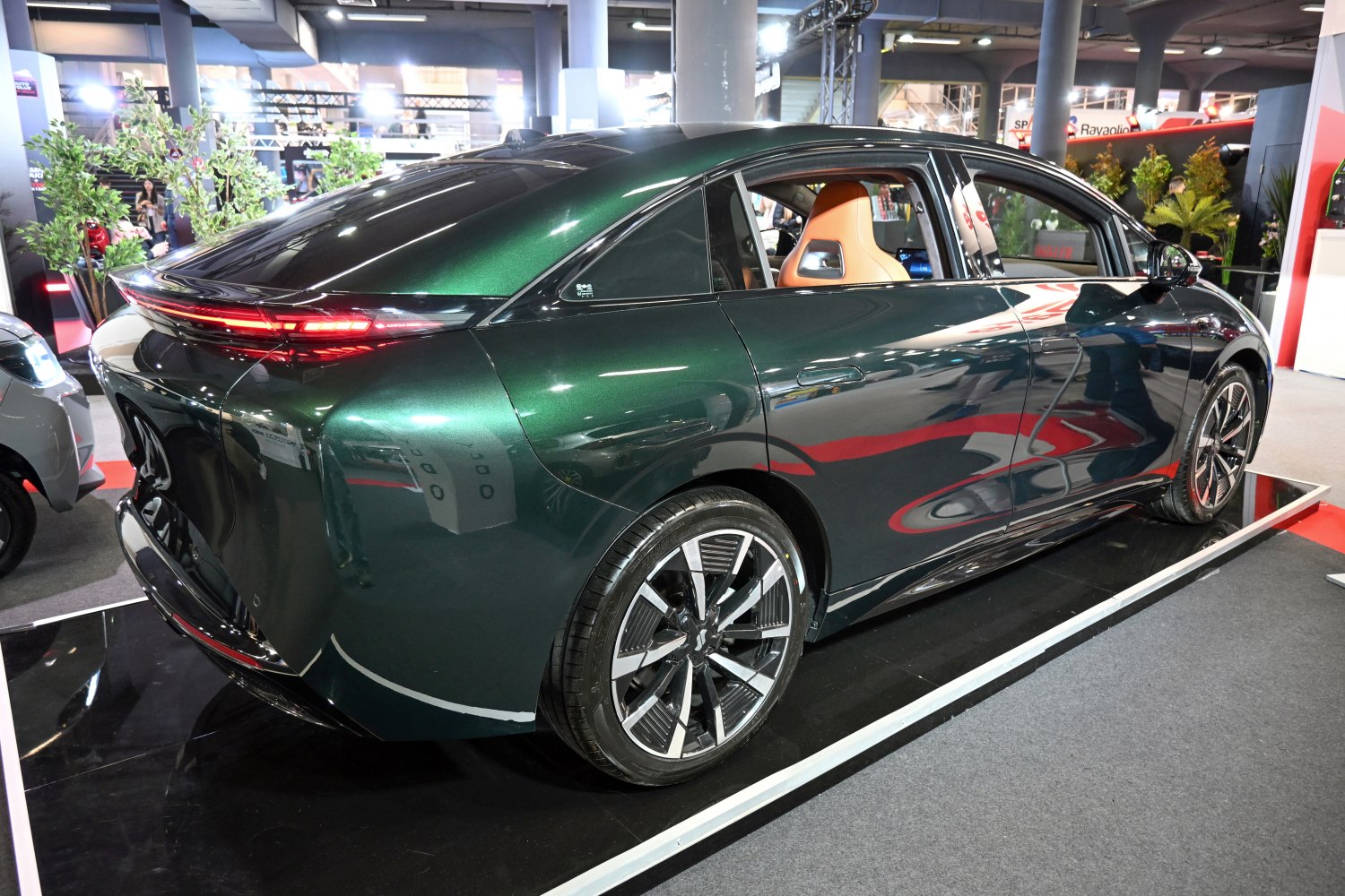Aerodynamic rear and modern alloy wheels of an electric sedan
