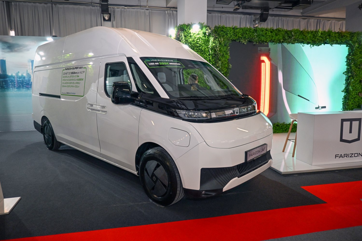 Futuristic front view and high roof silhouette of an electric van