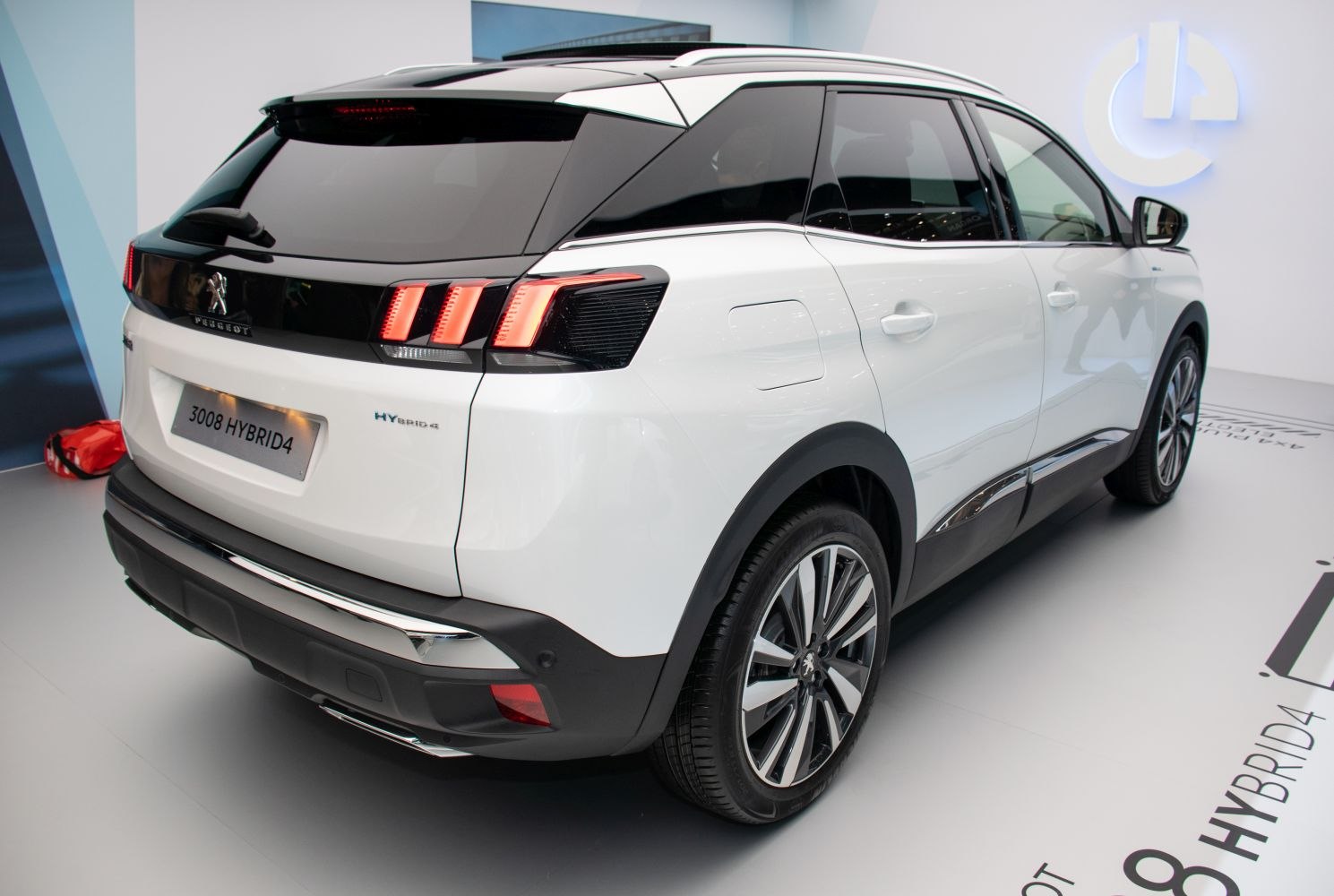 Hybrid SUV rear with LED taillights, alloy wheels, and tinted windows
