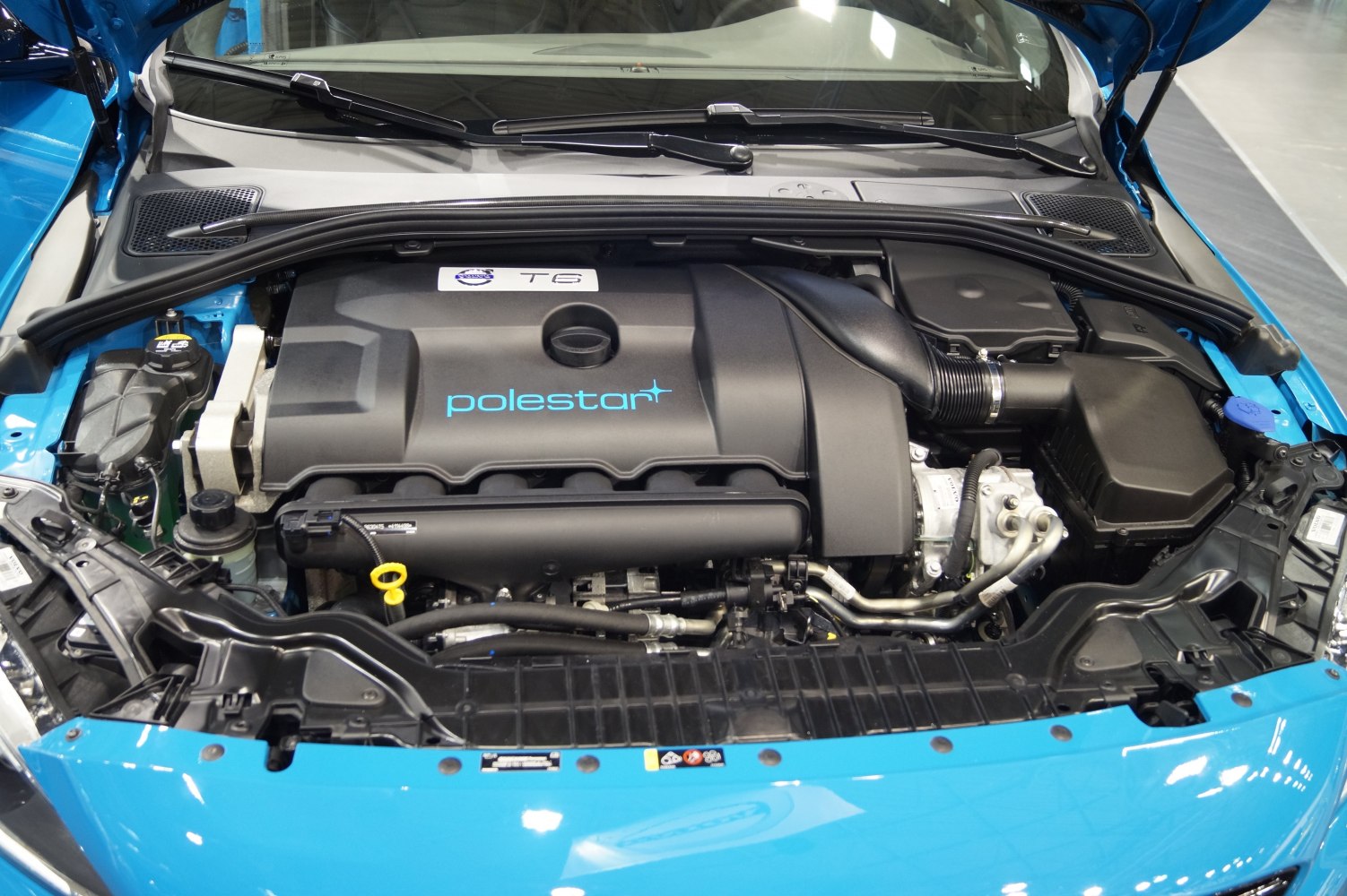 Polestar T6 engine bay with distinct engine cover and components