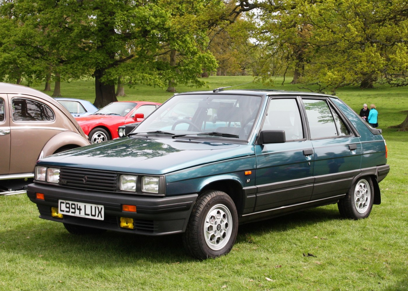 Boxy hatchback with yellow fog lights and multi-spoke alloy wheels