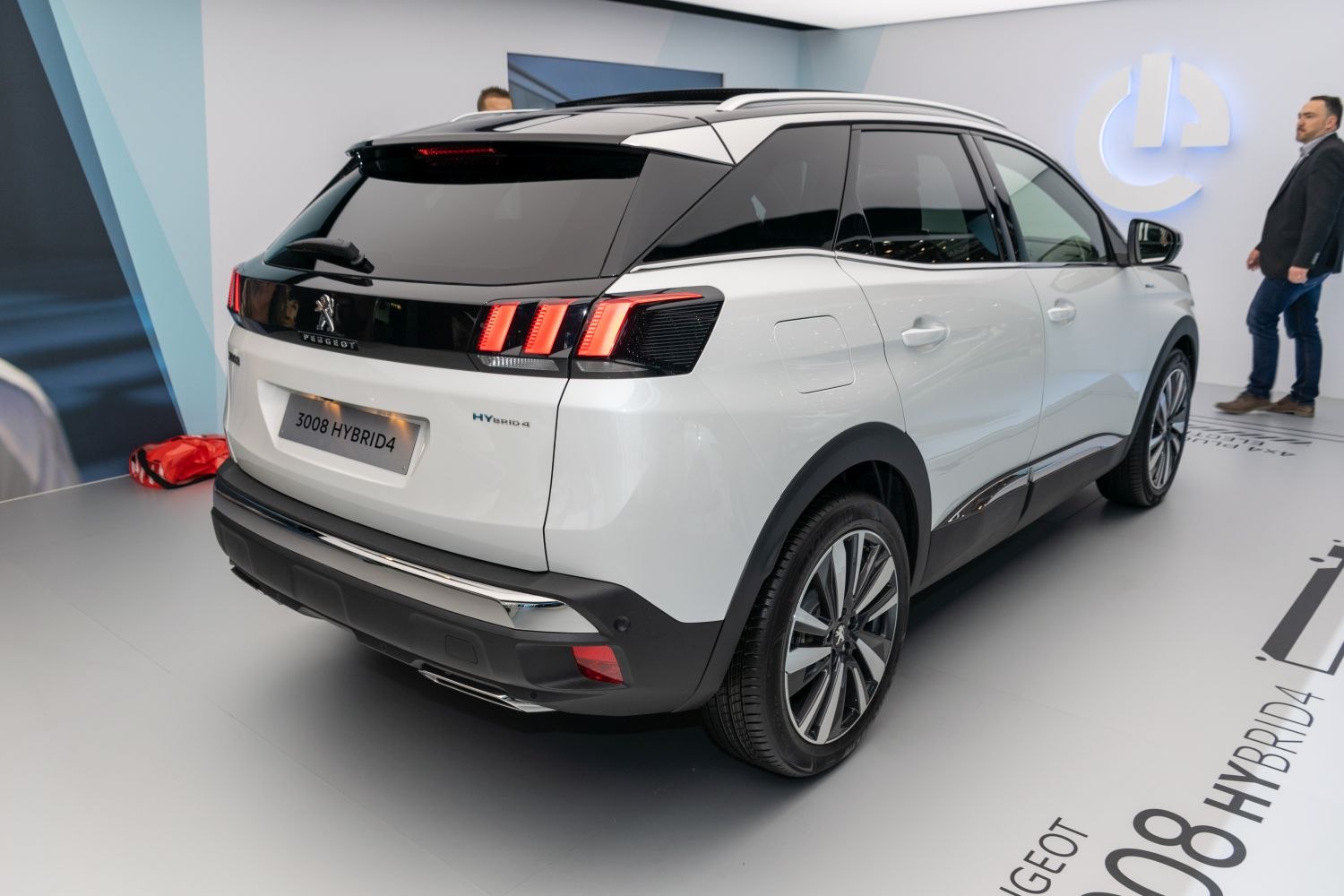 Rear and side view of a hybrid SUV with distinctive taillights and alloy wheels