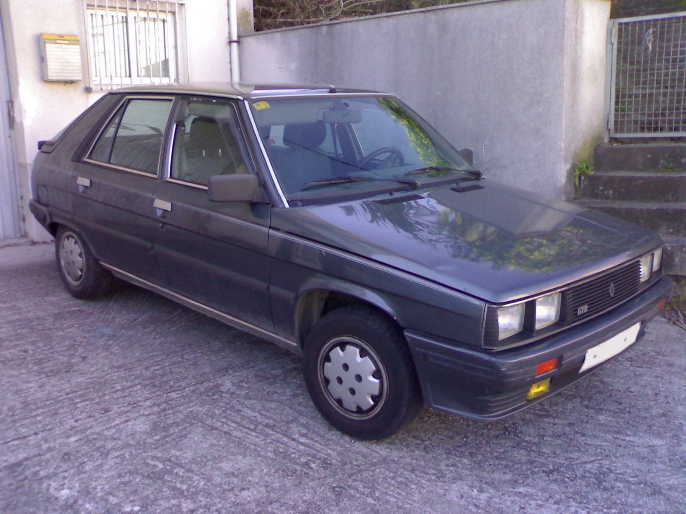 1981 vintage hatchback with rectangular headlights and boxy design