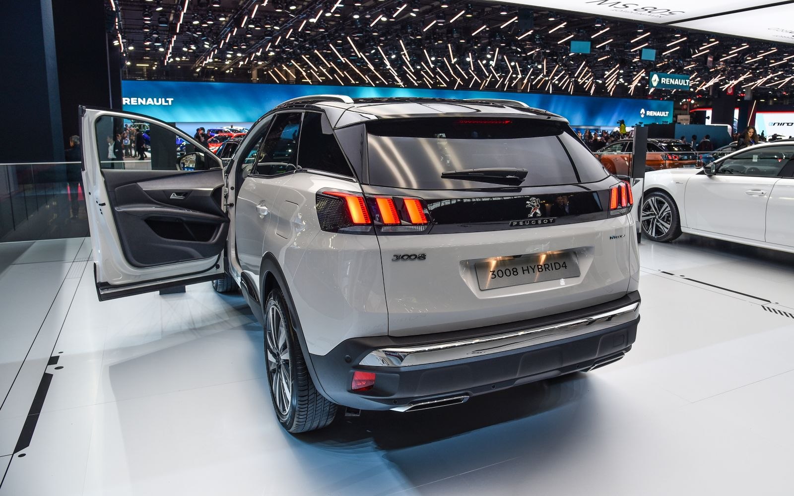 Hybrid SUV rear with distinctive tail lights and open rear door