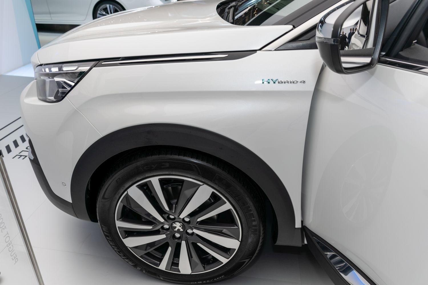 Front wheel with alloy rim and hybrid headlight detail