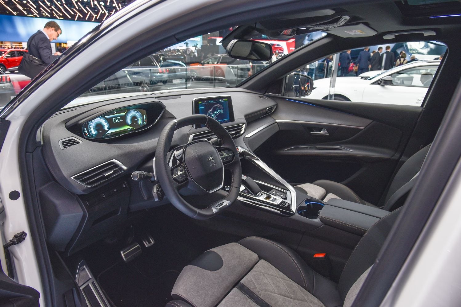 Digital instrument cluster and central touchscreen in car interior