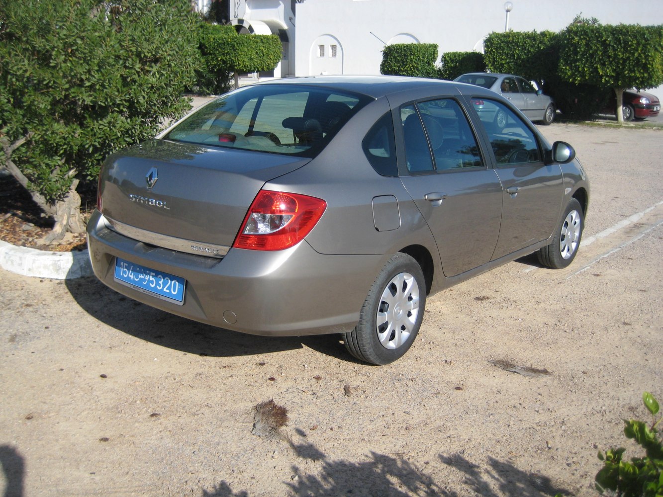 Rear view of sedan highlighting tail lights and license plate