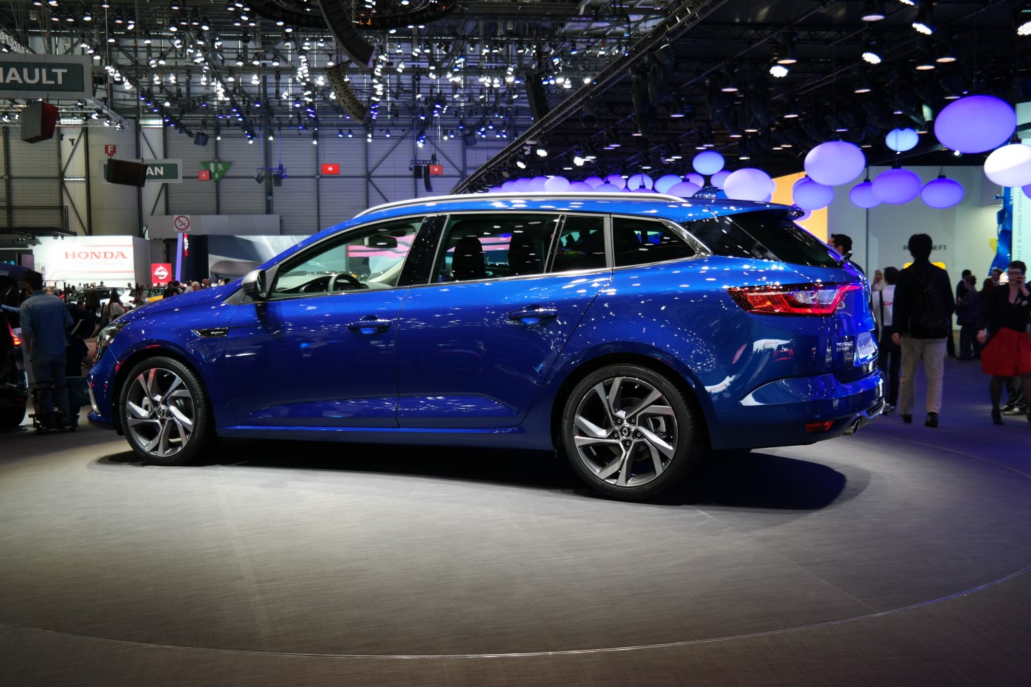 Side profile of blue station wagon with alloy wheels