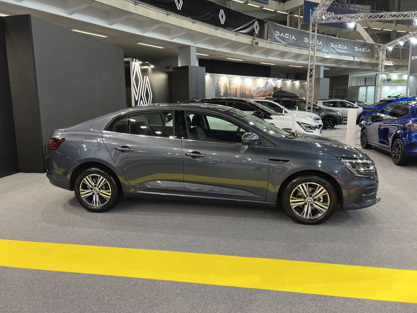 Side view of a modern sedan with sleek design and alloy wheels