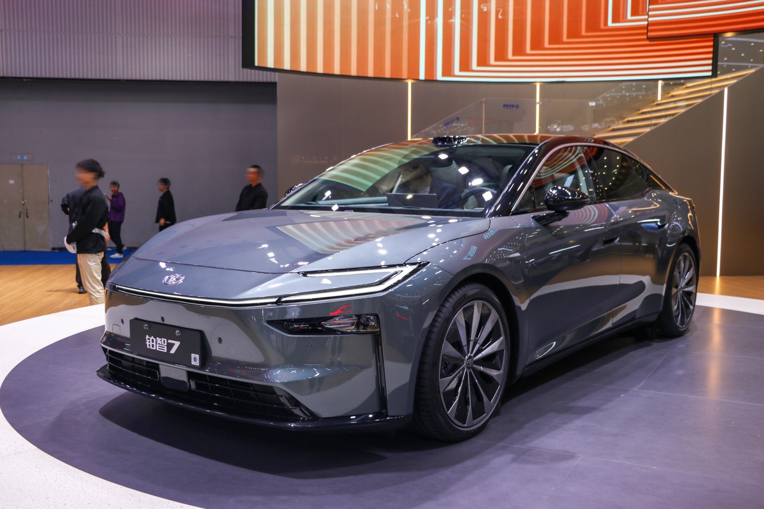 Modern electric sedan with sharp LED headlights and aerodynamic design