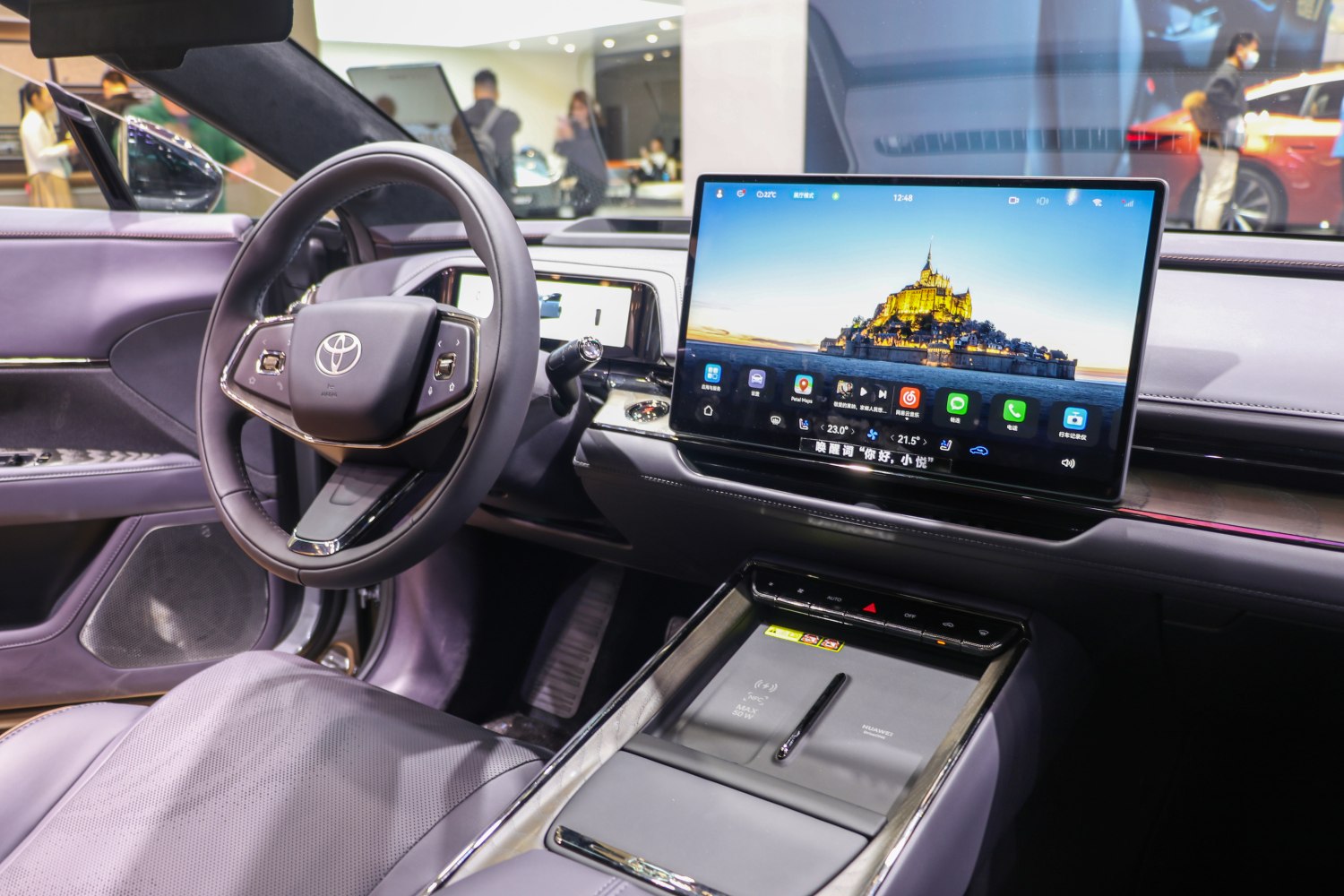 Modern steering wheel and large central touchscreen display