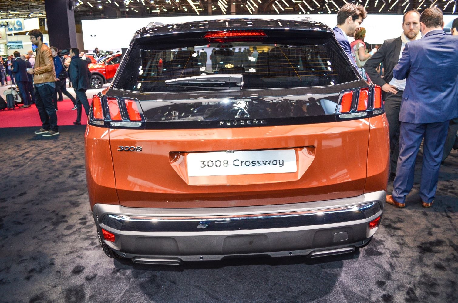 Rear view showing distinctive three-claw LED taillights and rear windshield wiper on a modern SUV.