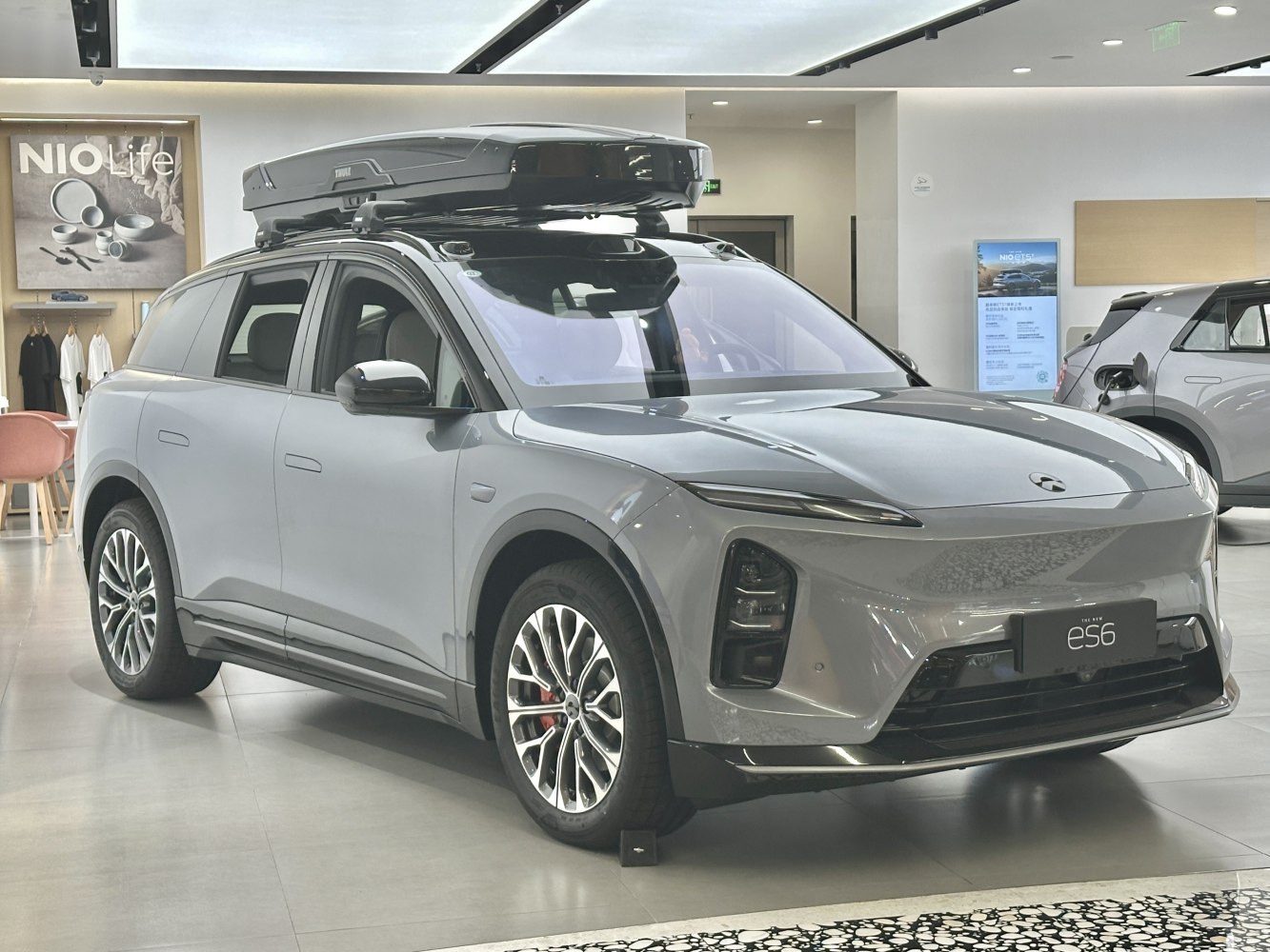 Electric SUV with modern design and rooftop cargo box