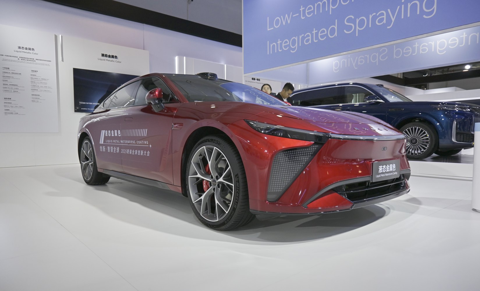 Sleek red electric sports sedan with liquid metal paint and aerodynamic design