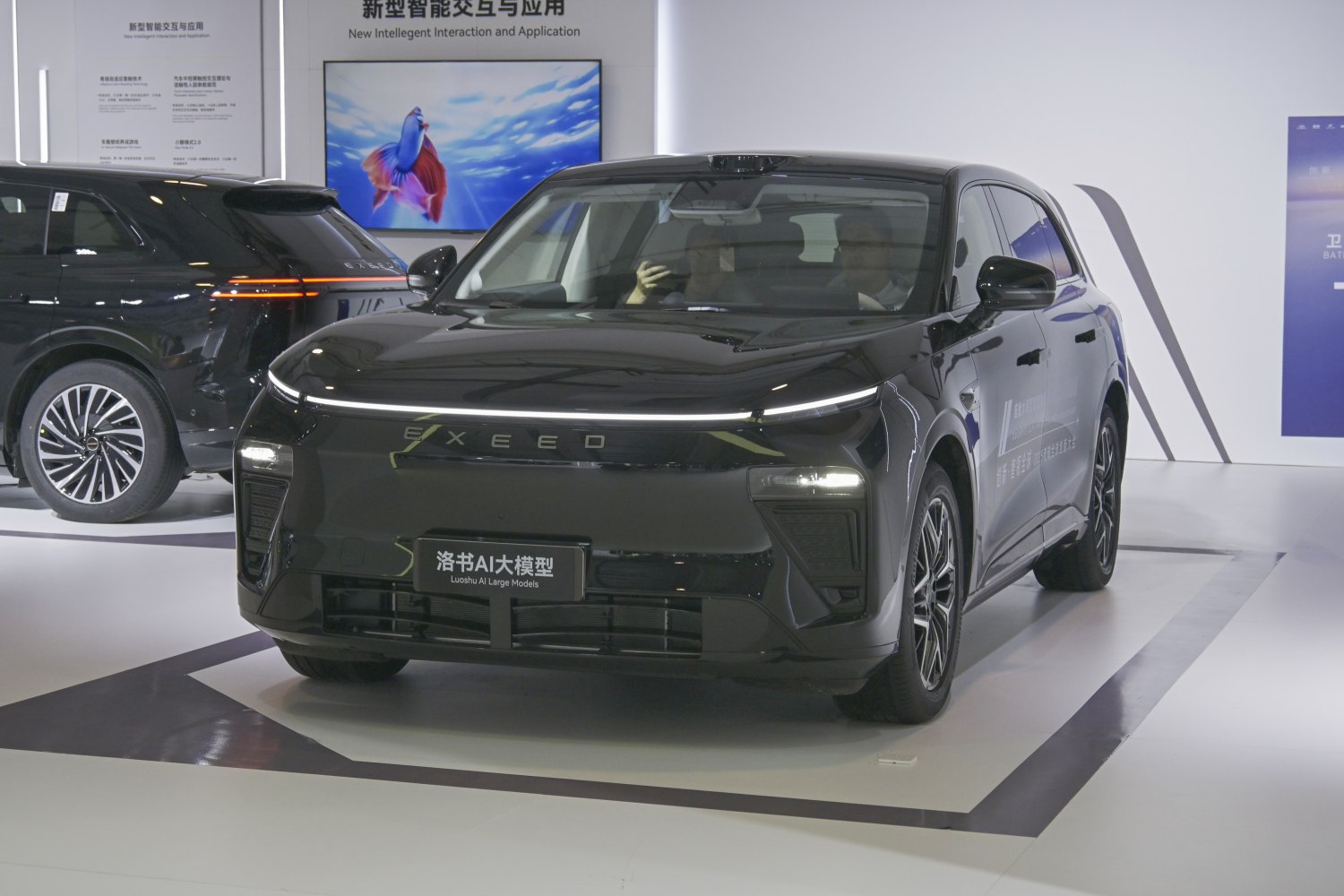 Front view of black SUV with continuous LED light bar and aerodynamic styling