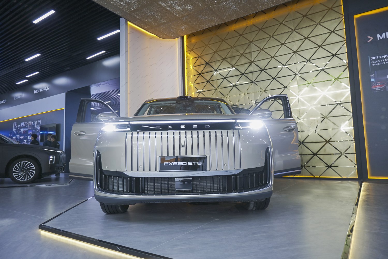 Bold front grille with vertical chrome slats and bright LED headlights.