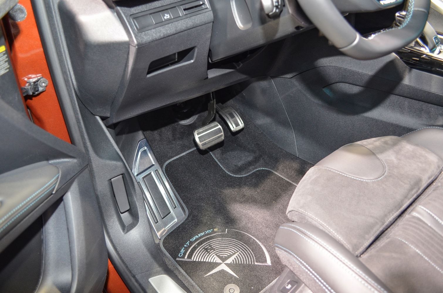 Driver's side footwell with pedals and floor mat