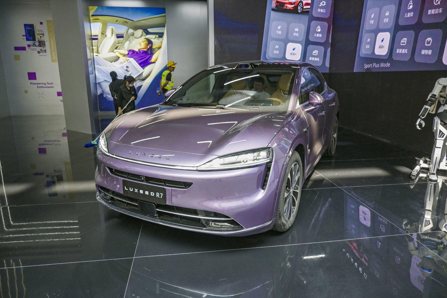 Front view of a sleek electric sedan with modern headlights.