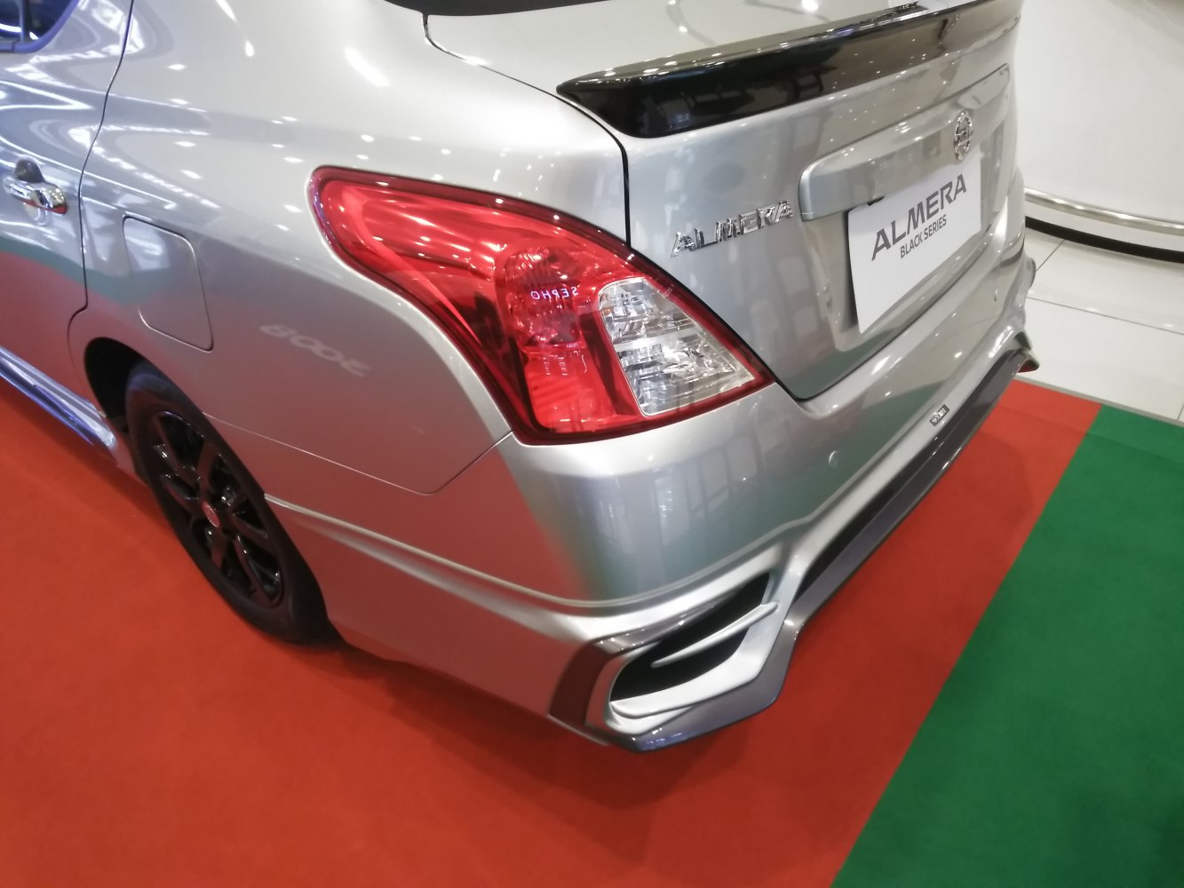 Rear tail light, spoiler, and sporty bumper design