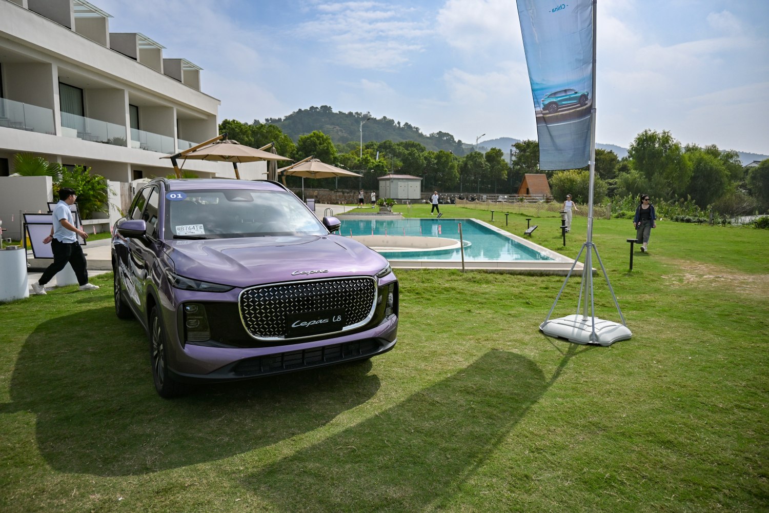 Front view of modern SUV with large patterned grille and LED lights