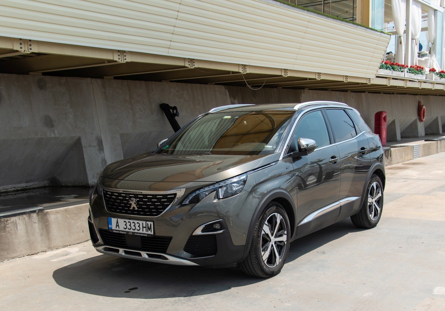 Modern compact SUV front-side view with LED headlights and alloy wheels