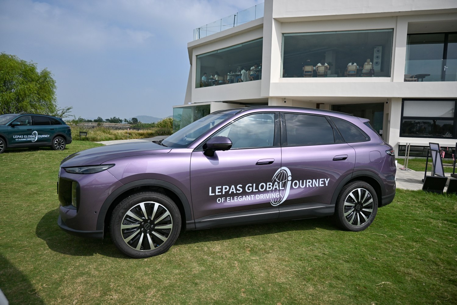 Purple SUV side profile with alloy wheels and sleek design
