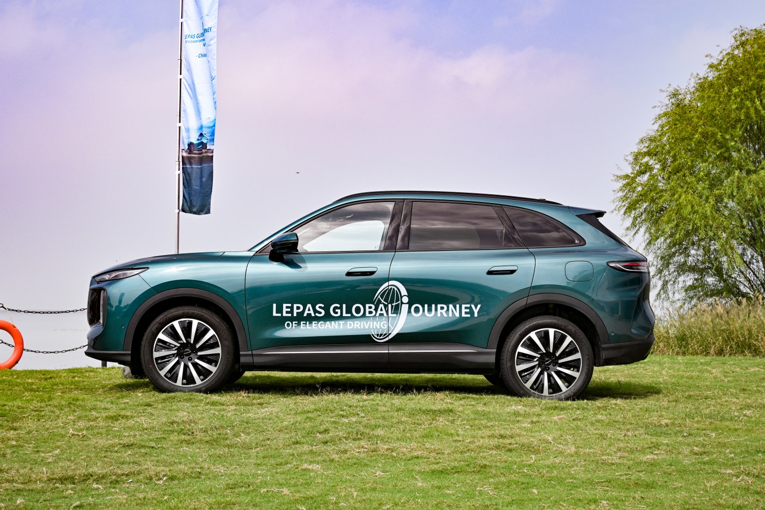 Side view of 2026 SUV with distinctive alloy wheels and sleek profile