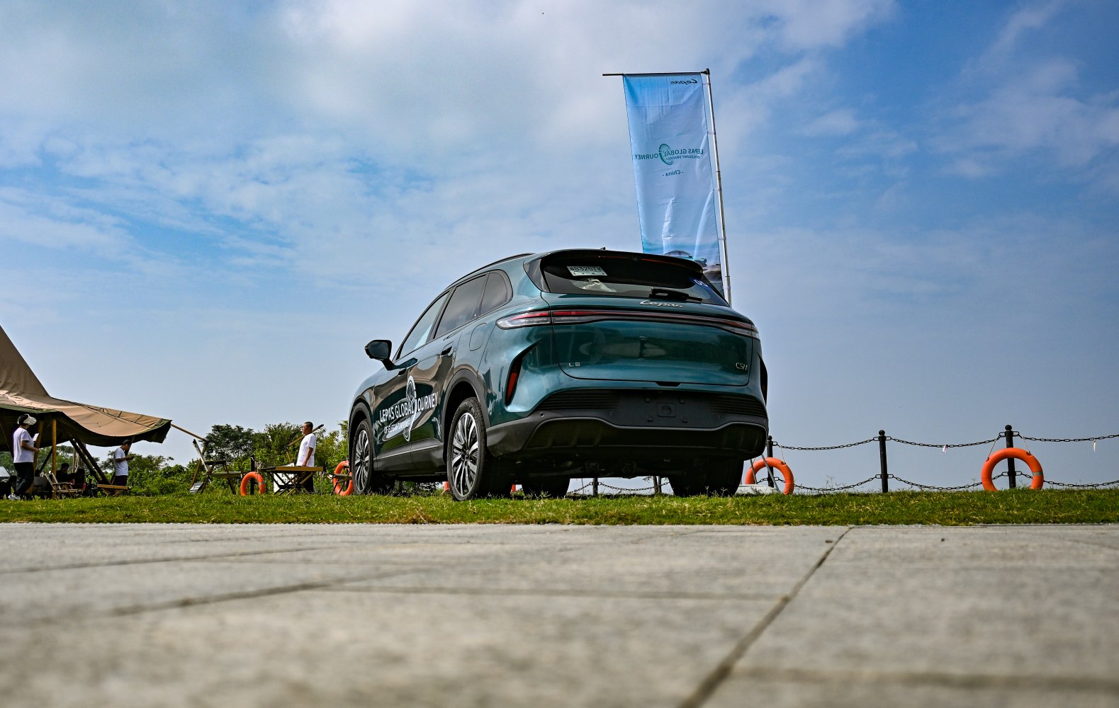 Rear view of modern SUV with continuous LED taillights and aerodynamic design
