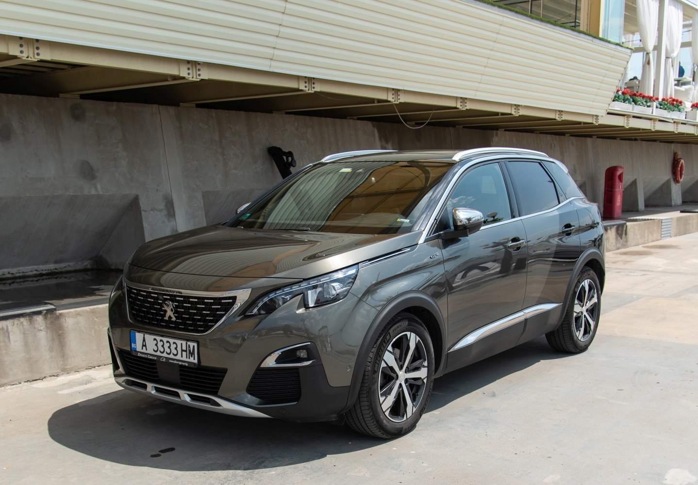 Modern SUV front view with distinctive grille and alloy wheels