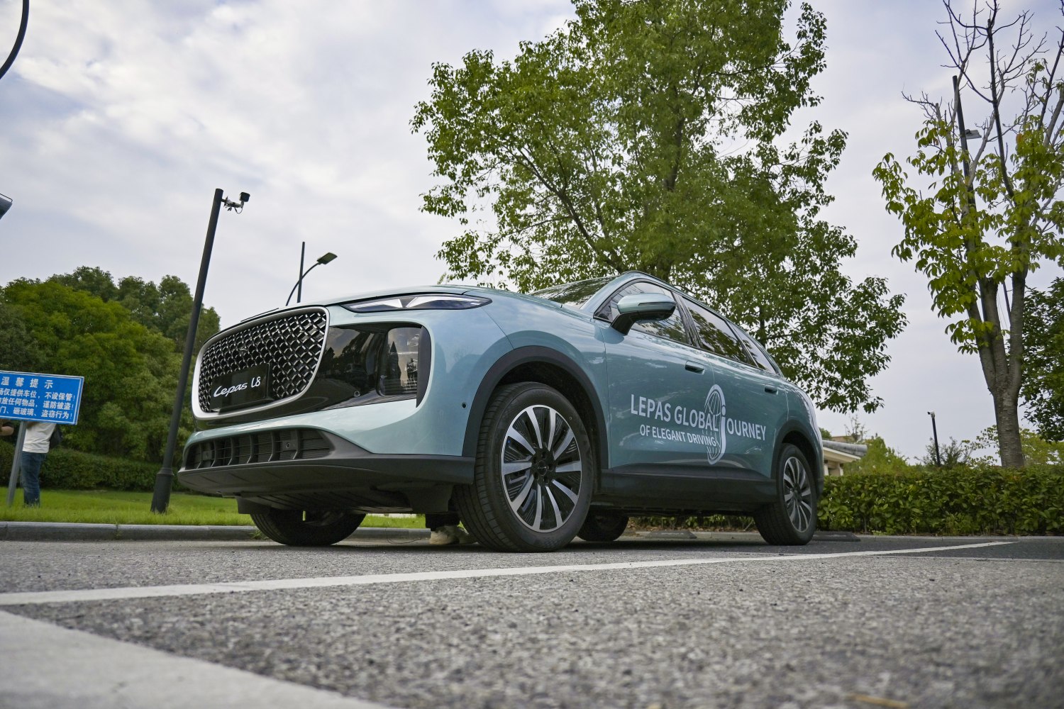 Futuristic SUV with prominent front grille and modern alloy wheels.