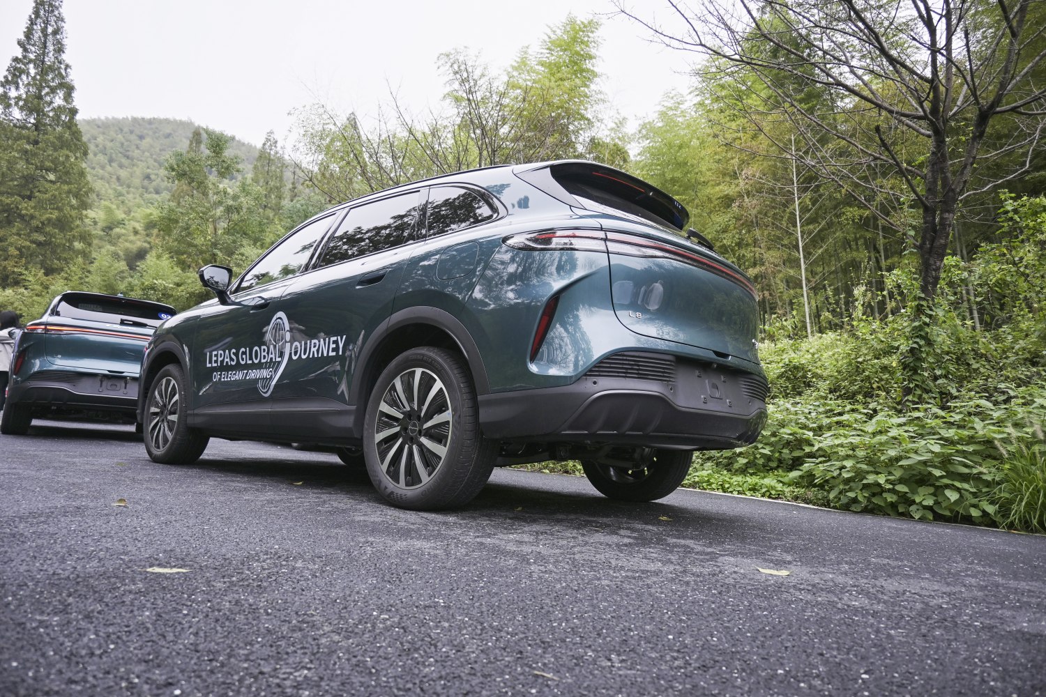 Rear and side view of an electric SUV with taillights and alloy wheels