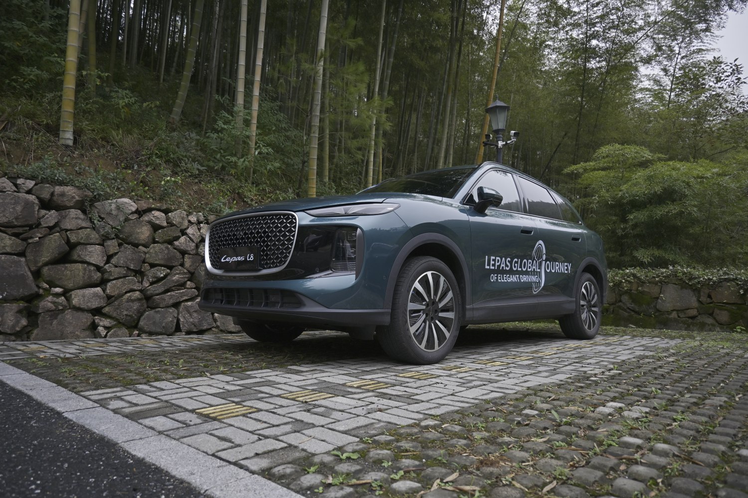 Sleek SUV with distinct front grille and aerodynamic design.
