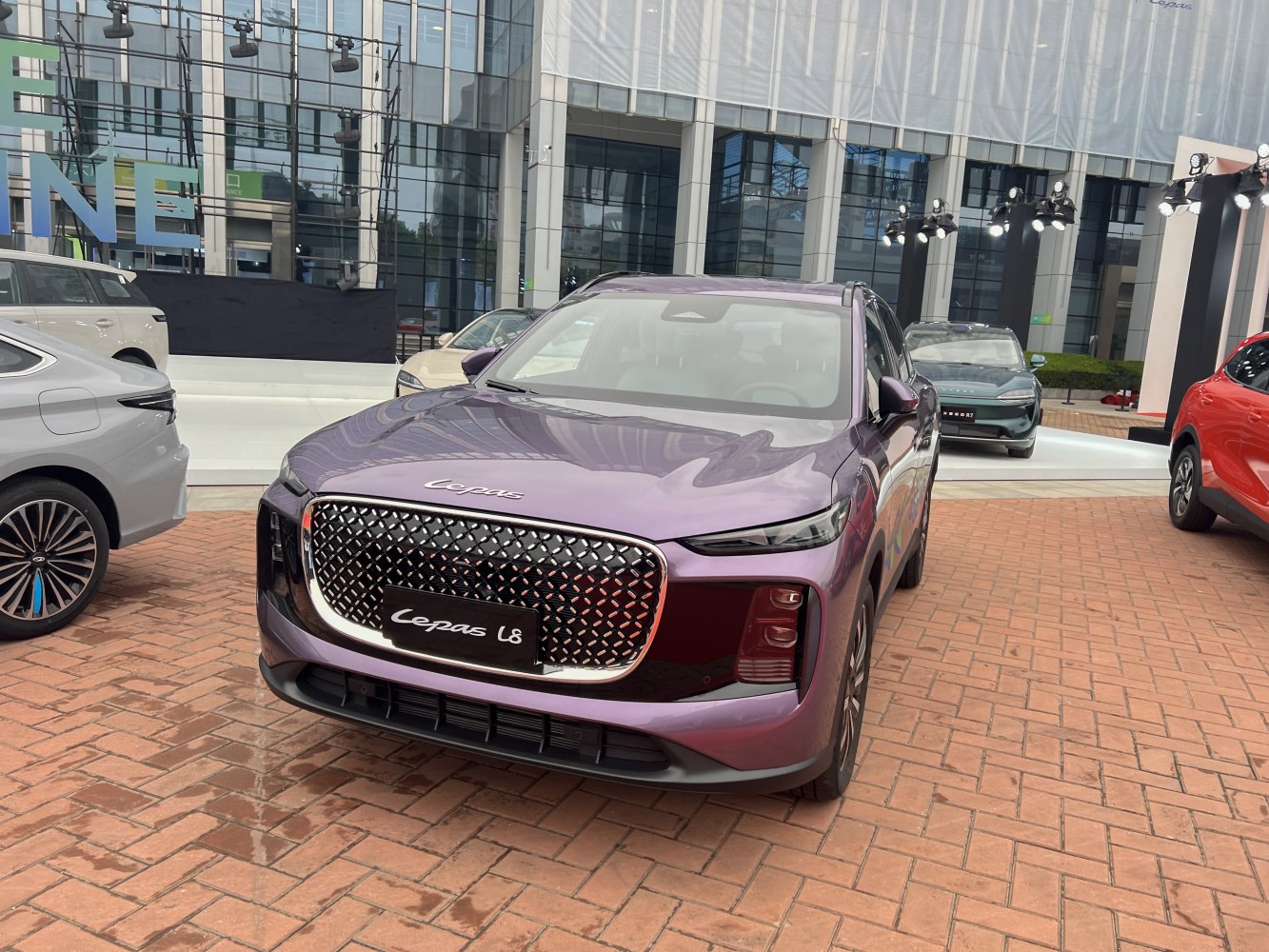 Modern luxury SUV front with large grille and sleek headlights