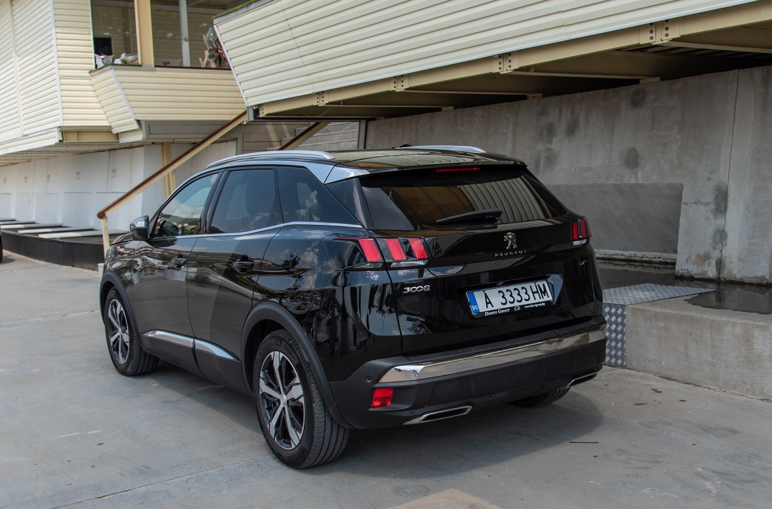 Rear view with distinct tail lights and alloy wheels