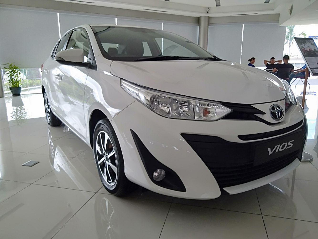 White sedan with sleek headlights and alloy wheels