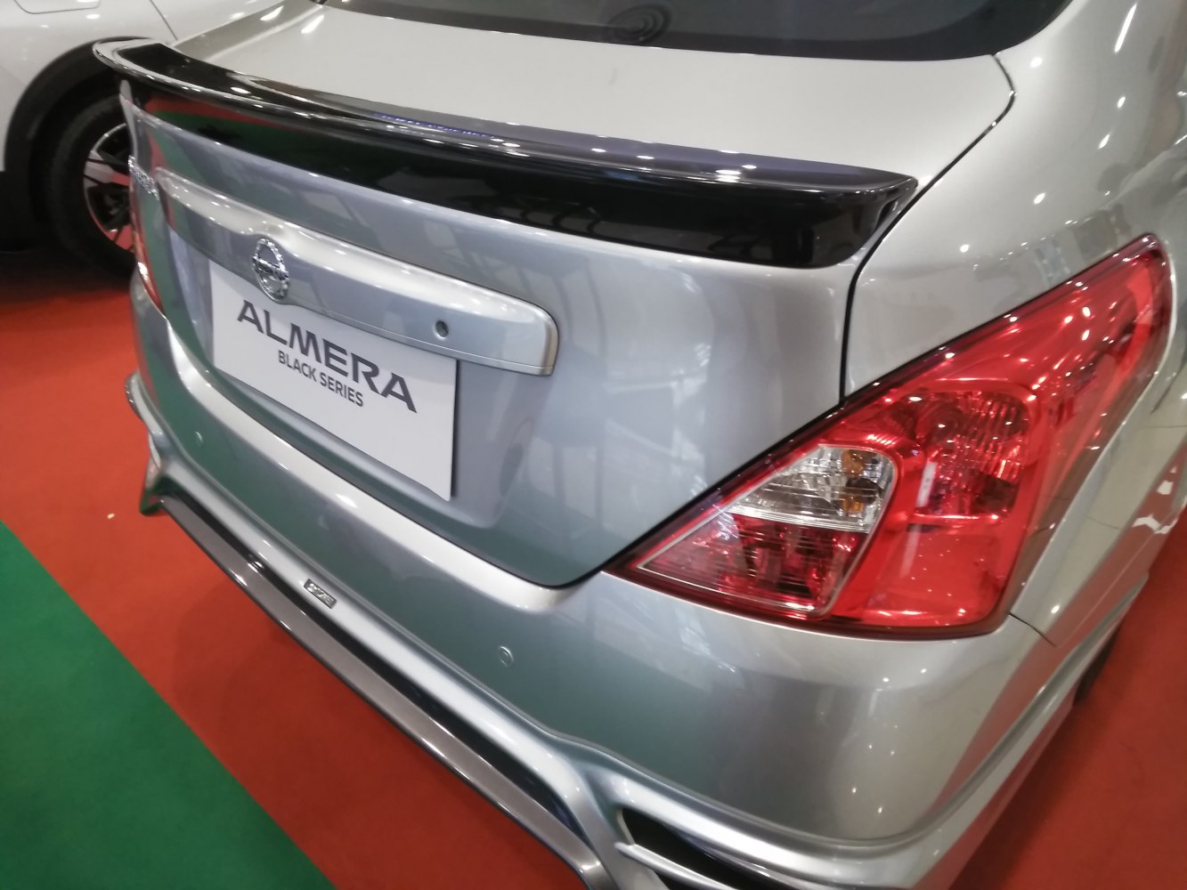 Rear spoiler and taillight close-up on car trunk