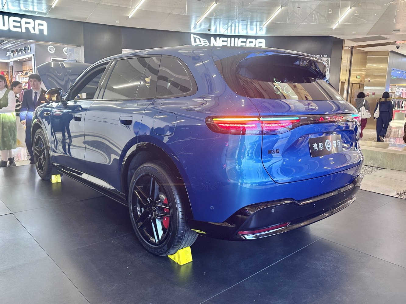 SUV rear design with LED light strip and black alloy wheels