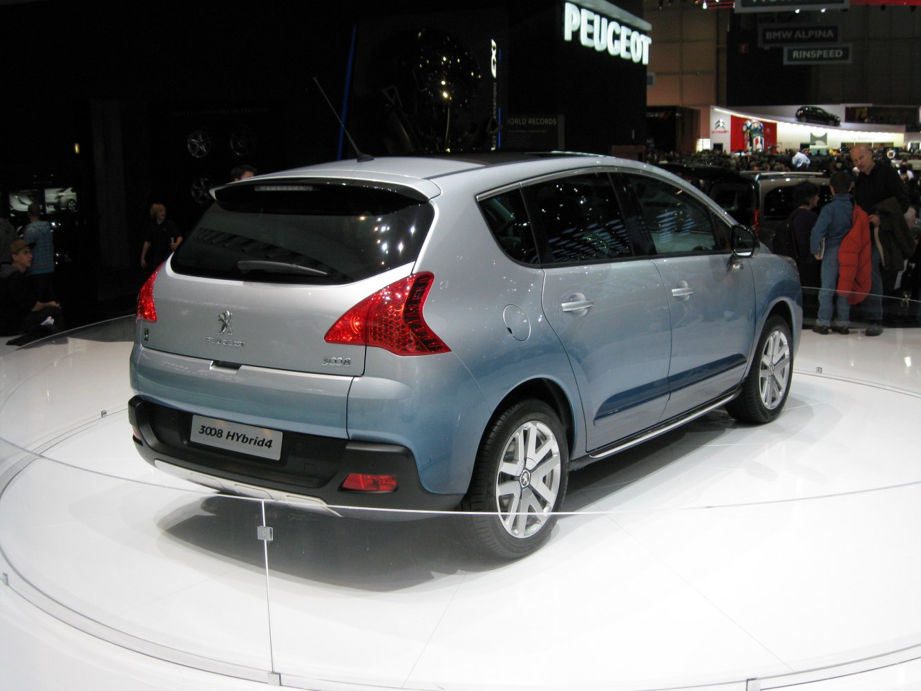 Rear-side view of a modern hatchback with hybrid technology