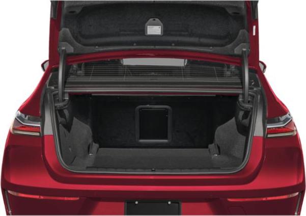 Open spacious rear trunk of an electric luxury sedan.